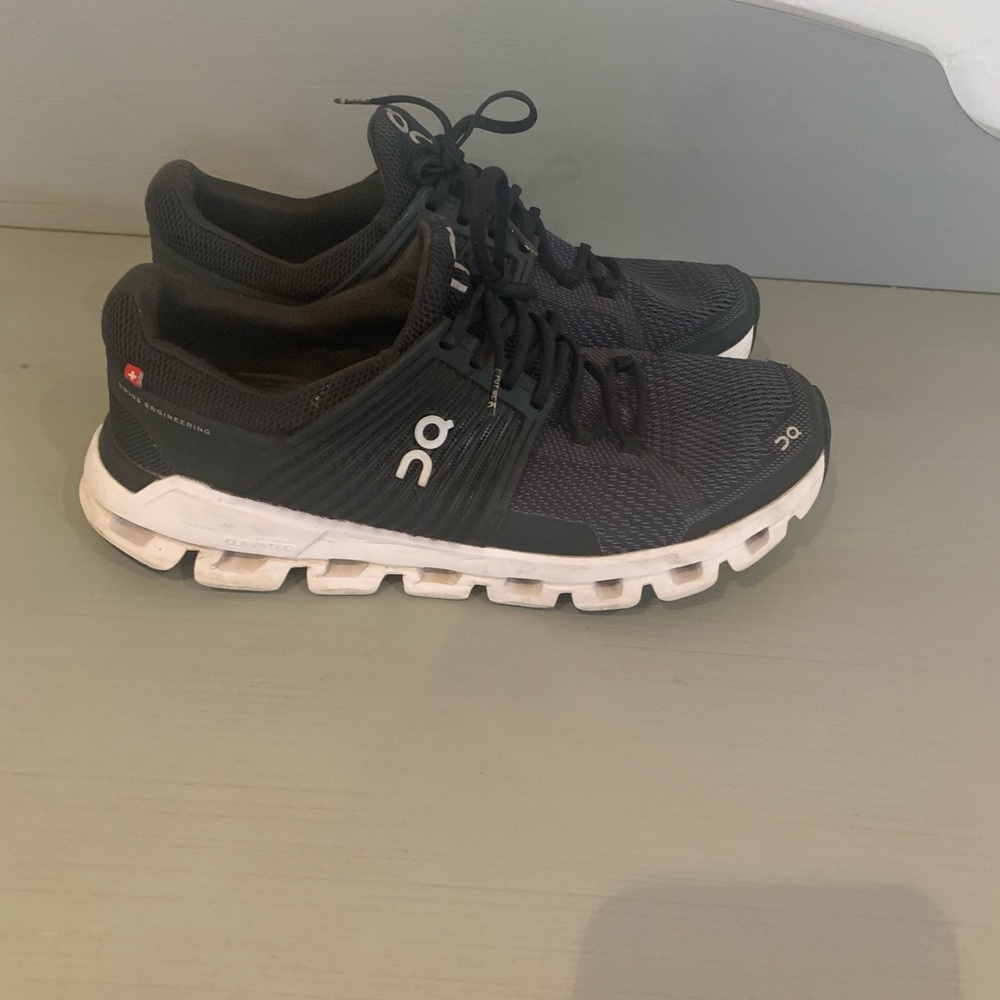 On cloud black running shoes
